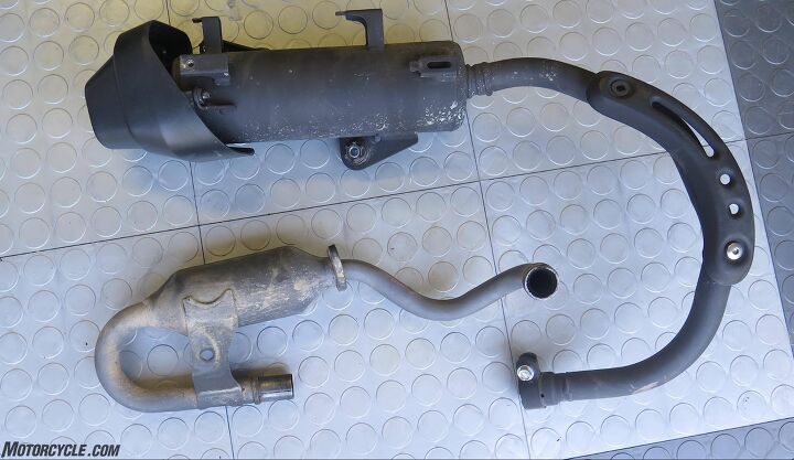mo tested akrapovic exhausts for honda monkey, It s not pretty but the stock header bottom with catalyzer appears to be a reasonably effective bash plate This one looks like it s been off road and not a ding in it