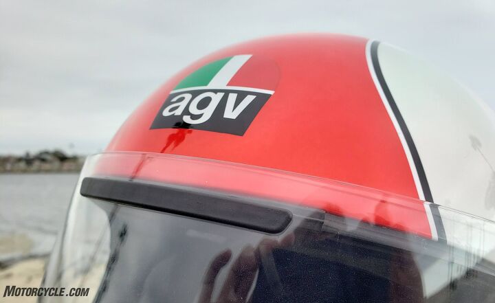 mo tested agv x3000 review, To open up the single vent on the front of the helmet users will need to pop out the rubber insert Thankfully AGV provided a small sleeve on the underneath side of the right cheekpad to store the insert when it s not in use