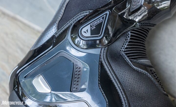 The exoskeleton’s flexible ankle hinge combines with the accordion panel to make the boots easy to walk in and manipulate the motorcycle’s controls.