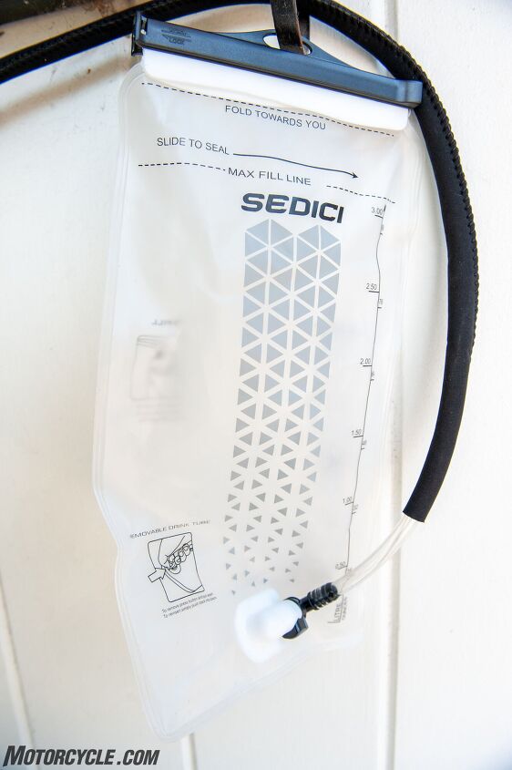 mo tested sedici acqua hydration backpack, Yep it s a water bladder It holds three liters folds inside out easily for drying and features a cool quick release button for the drink tube to make refilling cleaning and drying easy