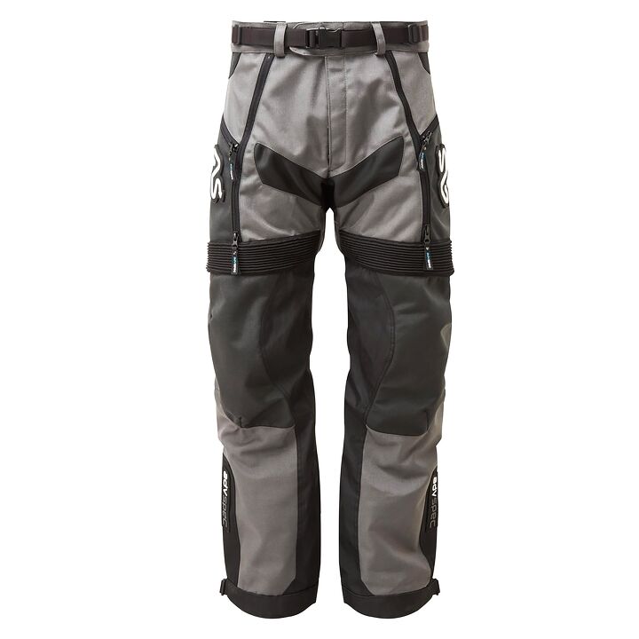 The Mongolia Trail pant is an over-the-boots deal designed for adventure, trail and dual-sport riding, made of tough 1000D ballistic nylon in the abrasion zones. Big, zippered thigh vents flow a lot of cooling air. Washable, heat-resistant knee fabric is claimed to outlast and outperform leather, and designed to fit over knee braces – or you can insert armor into the internal knee pocket. A ‘fit once’ ankle buckle ensures the lower legs stay closed. Weight – 1510 grams, says Adventure Spec, equals 52.4 ounces equals 3.3 pounds. Not bad. $385