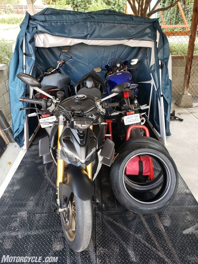 mo tested speedway motorsport shelters, The Deluxe model loaded with three sportbikes stands and tires It can also fit two touring bikes or even a trike like a Can Am Spyder