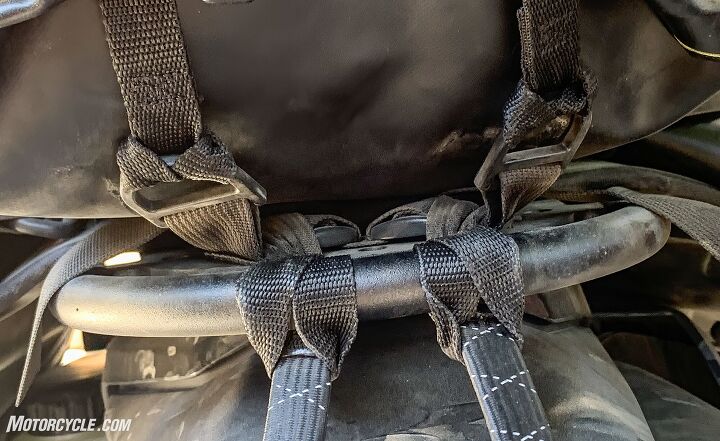 The mounting loops can affix the straps to a variety of locations. Here D-rings and a luggage rack are shown.