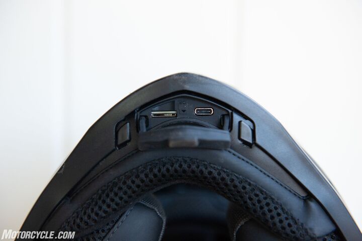crash tested with video forcite mk1 smart helmet review, Underneath the chin bar is a covered opening that reveals the memory card slot and the USB C port to charge the helmet s battery With an accessory media cable sold separately you can plug into the port and your phone to view your media