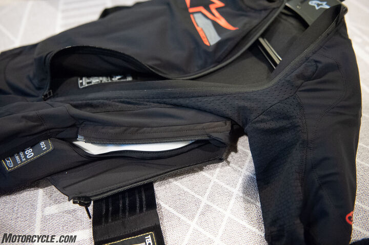 On each side of the Tech-Air 10, you’ll find smaller connection zippers. These are the airbag’s main attachment points to the base layer. You’ll have to undo a series of Velcro connectors and snaps up and down the system to fully remove the airbag (seen in white). On the left, where the Alpinestars tag is sewn in, is the physical airbag that extends into the thigh pocket of the base layer.