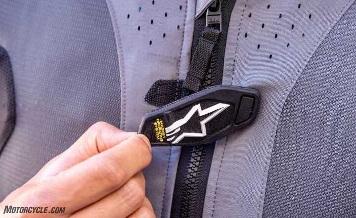 This velcro tab is located near the top of the TA5’s zipper. Connect it and the system will activate. The annoying thing about the tab is that it tends to connect when you have the vest on a hanger in your closet, not in use. Thus draining the battery unnecessarily.