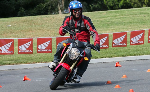 2014 honda grom review video, Wearing funny glasses and a Captain America helmet is just par for the course when riding the Grom It really brings out the teenager in everyone