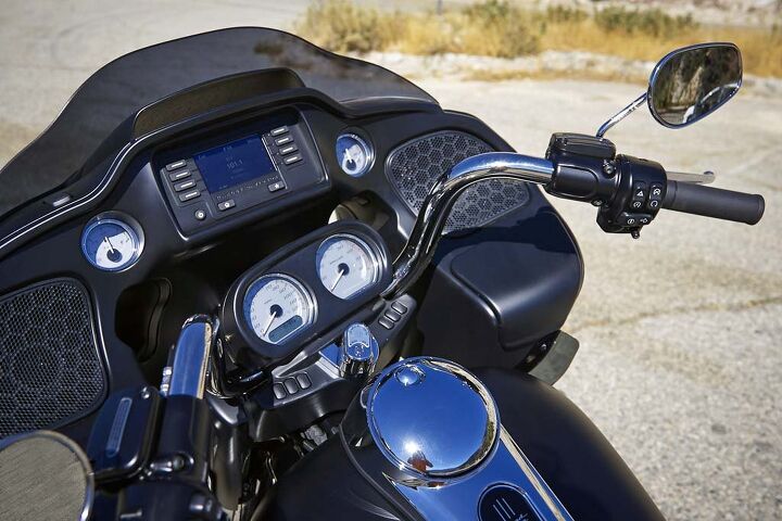 2015 harley davidson road glide first ride review video, Check out them thar speakers You can almost hear AC DC coming through the photo Below each speaker resides a small self closing glovebox The one on the right features a USB connector but no way to secure your smartphone or iPod