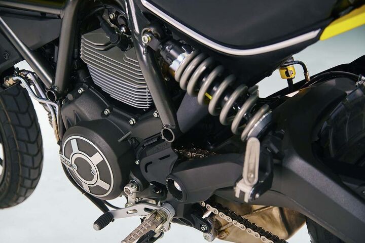 2015 ducati scrambler unveiled video, The Scrambler s aluminum swingarm acts directly on a preload adjustable shock Interestingly a gray shock spring is used rather than Ducati s traditional yellow springs