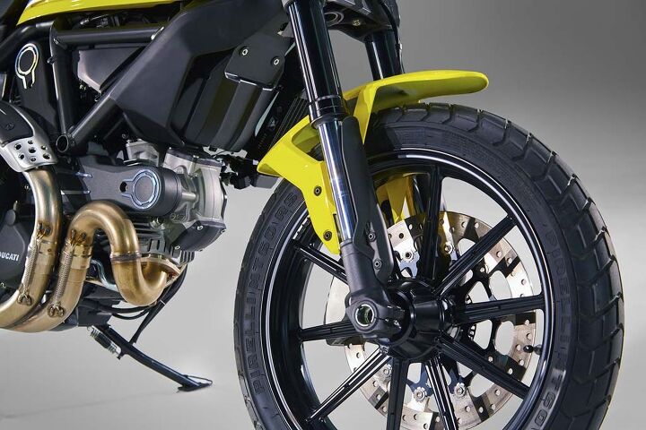 2015 ducati scrambler unveiled video, A single front disc brake shows off the right side of wheels unique to the Scrambler