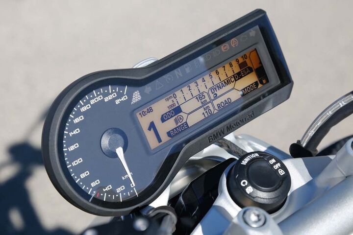 2015 bmw r1200r first ride review video, An analog speedo is accompanied by a TFT display packed with information from the onboard computer that you can reduce to not so much in Tourist mode The tach s too small to read but who needs it with a big grunty Twin A light sensor automatically adjusts for ambient light and day and night designs