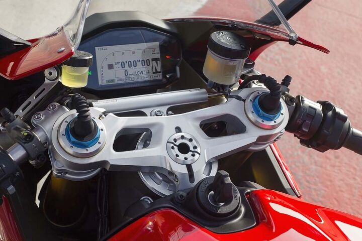 2015 ducati 1299 panigale first ride review video, Color TFT instruments are a pleasure to read and feature screens optimized for each of the three ride modes Rain Sport Race In each the lower part of the panel displays the selected settings for Ride Mode DQS DTC EBC DWC and ABS New to the 1299 is an available lean angle display Wires at the top of the fork tubes reveal this to be a 1299 S which features hlins electronic suspension