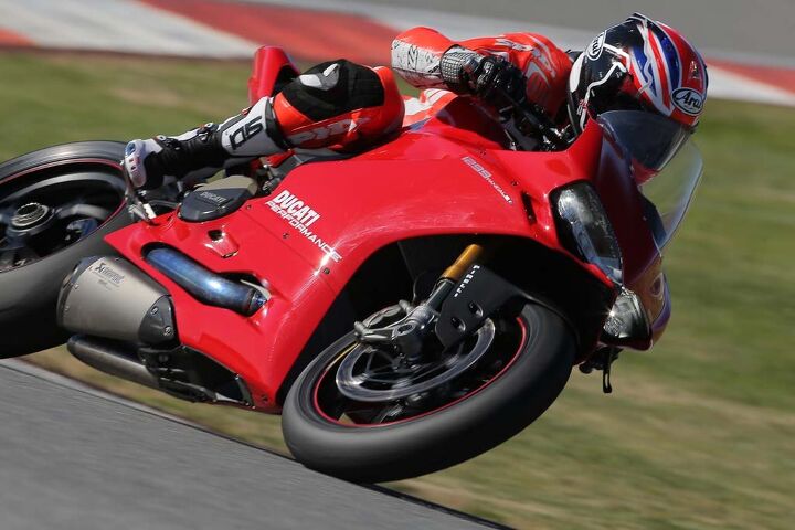 2015 ducati 1299 panigale first ride review video, The Ducati Performance bike was also equipped with a taller windscreen that dramatically improved wind protection at speed The stock windscreen created massive turbulence at helmet level as speeds exceeded 150 mph