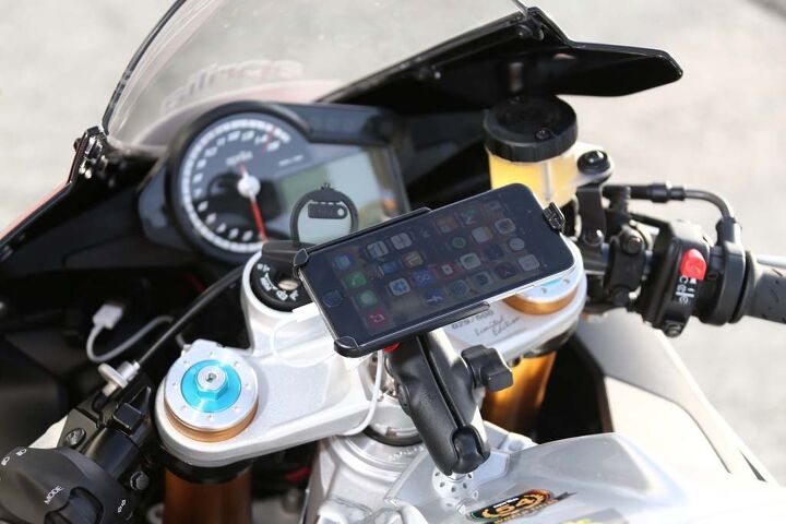 2016 aprilia rsv4 first ride review video, One aspect of this launch was unprecedented the test bikes were fitted with iPhones Aprilia s V4 Multimedia Platform app connects the RSV4 to smartphones and then the motorcycle to the internet