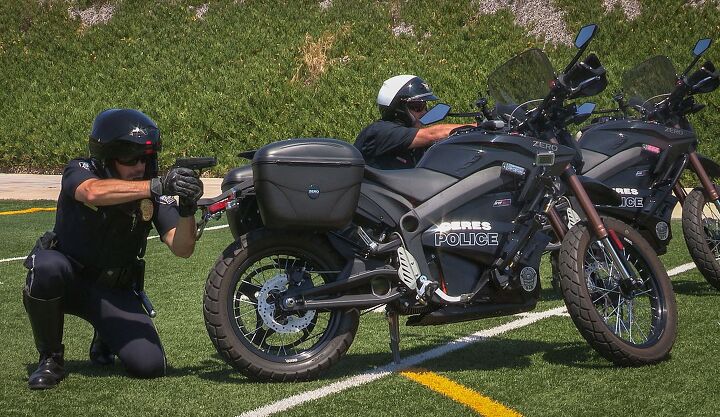 the life electric you have the right to remain silent, Lieutenant Perry left and Sergeant Coley right practice at the Ceres Police Department firing range in a mock exercise that uses their Zero police motorcycles as cover Photo by Jay McNally