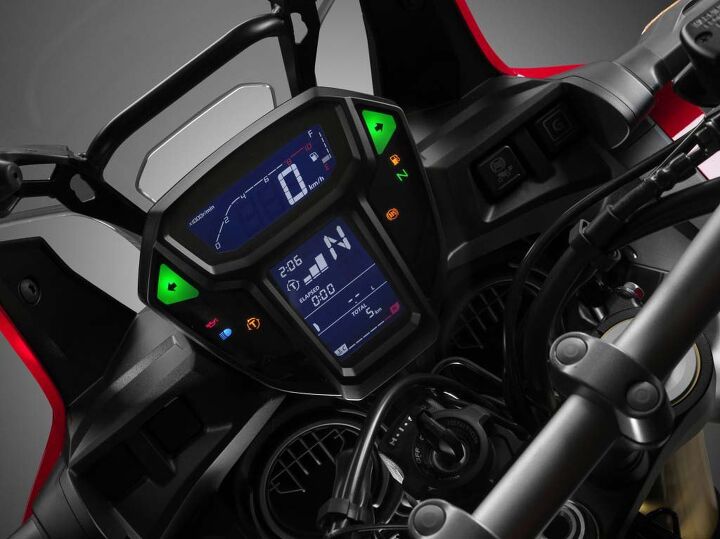 2016 honda africa twin review, TC levels are below the clock and next to the gear position indicator Speedo tach and fuel gauge are in the readout above The entire cluster is a clean legible design Note the windscreen is non adjustable but the bubble of still air behind the windscreen is remarkable considering the screen s small size