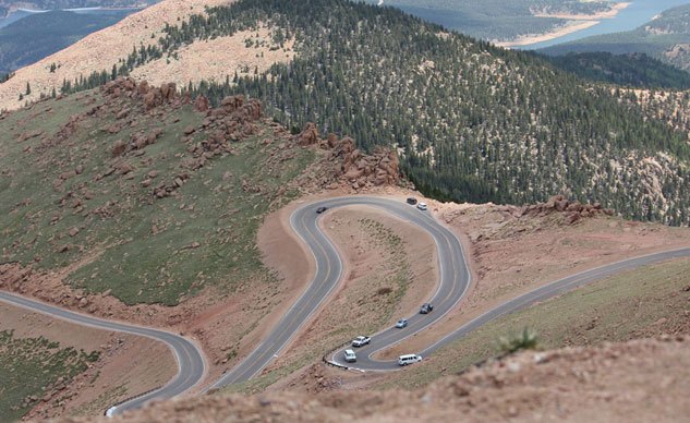 motorcycle com races to the clouds at pikes peak, At the higher altitudes above the treeline jagged rocks replace the evergreens