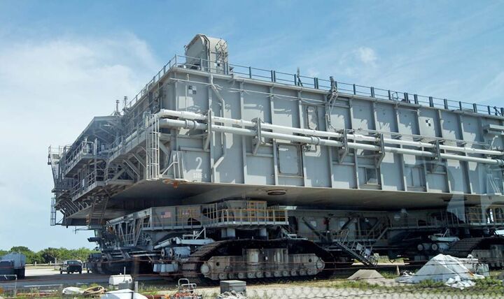 the wings tour 2014 leg three video, One of NASA s crawler transporters that move a space shuttle from the assembly building to its launch pad Powered by two 2 750 hp diesel engines it weighs 6 million pounds Notice the full size pickup truck in the lower left corner for comparison