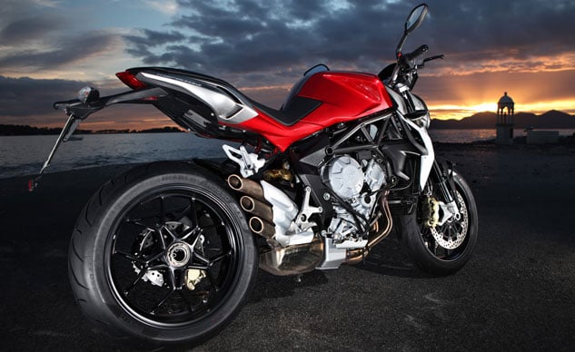 2013 italian middleweight streetfighter comparo video, The Brutale in Ruby Metallic Red is striking An under engine exhaust collector and stubby triple exit pipework leaves its rear wheel more exposed than the Streetfighter s