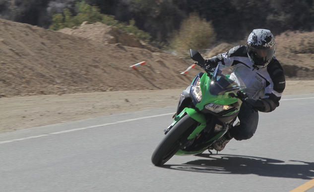 2013 beginner sportbike shootout part 2 video, Footpegs placed relatively high give the Ninja 300 excellent ground clearance We love its solid and agile chassis making it our choice of the three whenever the road ahead is squiggly