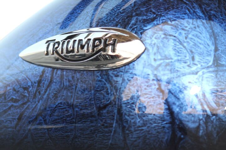 2013 world cruiser shootout video, The Triumph s optional soft sultry Haze paint option is gorgeous Roderick joked that it looked like a bowling ball but with his next breath gushed Hey I love bowling