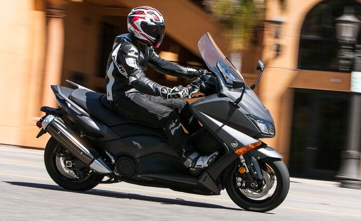 all caps scooter shootout honda nm4 vs yamaha tmax video, Immediate acceleration from a stop makes the TMAX a great around town mount