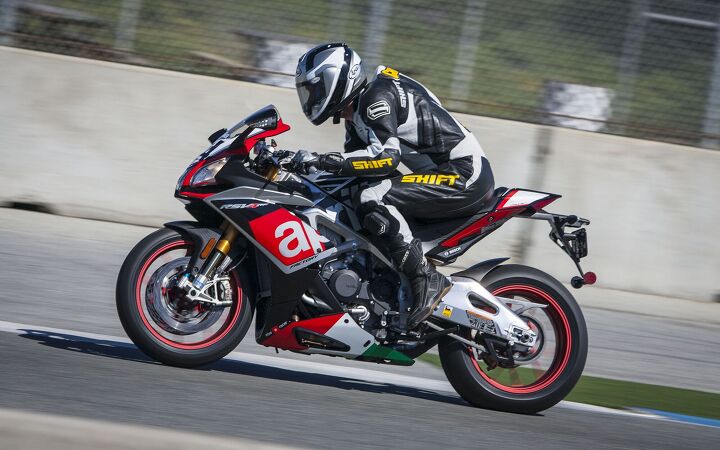 2015 six way superbike track shootout video, Taller riders might feel a little squished on the Aprilia as here 5 foot 11 inch Doug Chandler has his elbows above his knees despite being all the way back on the seat