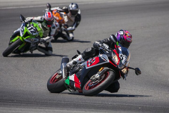 2015 six way superbike track shootout video, From nearly all performance related aspects the Aprilia is seemingly light years ahead of the old Kawasaki and even older Honda