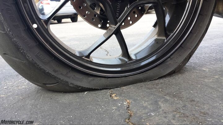 2016 ultimate streetfighter shootout, After running out of fuel on the Tuono on the way back from Buttonwillow T Rod used the KTM to push the Priller at up to 55 mph on the shoulder of a busy I 5 where the SDR s rear tire found a sharp object