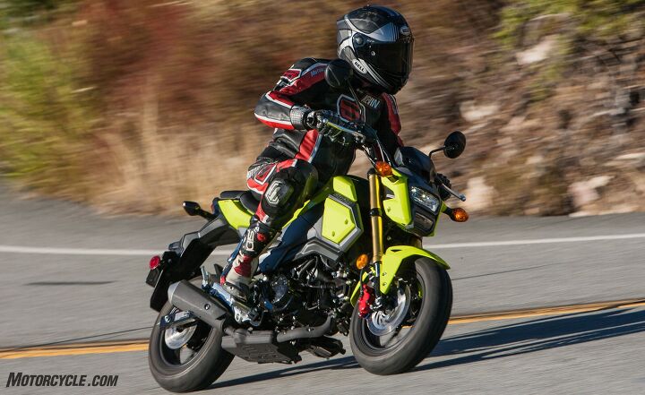 battle of the 125cc ankle biters part 2, The Grom s new redesign is capped off by its headlight What does Kevin think of it It looks a little like Iron Man s helmet he noted