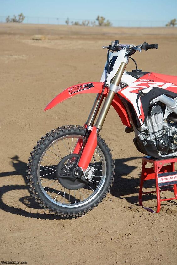 honda crf450r vs husqvarna fc450 vs kawasaki kx450f vs ktm 450 sx f vs suzuki, Honda has replaced the CRF450R s 48mm KYB PSF air fork with an all new 49mm Showa coil spring unit with internals from the company s Race Kit suspension The Showa outperforms the air fork by being more sensitive over smaller bumps while retaining excellent big hit capability
