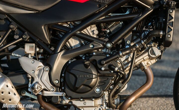 middleweight naked bikes a 2017 shootout, With its plethora of hoses wires and big Adam s apple of an oil filter the SV s beauty is in the eye of the beer holder