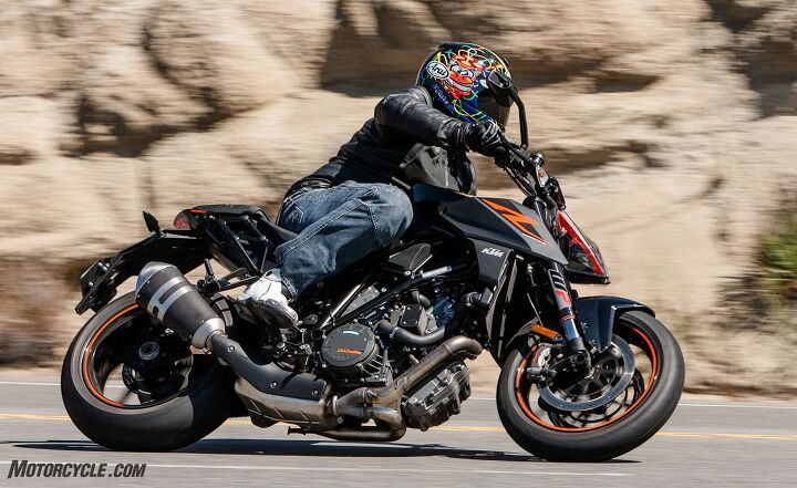 2017 supernaked streetfighter shootout, Our largest editor used all of the KTM s roomy ergonomics and acknowledges its best in class street comfort even if he did slightly prefer the more compact Aprilia s ergonomic package as a whole