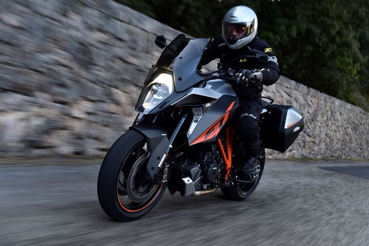 2017 ktm 1290 super duke gt first ride review, The tinted shield shown on this bike is an extra cost accessory despite an inner shield seen at its lower part surrounding the headlight being tinted Ironically the clear shield that comes standard actually costs more to produce because it needs paint and tinted areas so the headlight doesn t reflect back to a rider at night