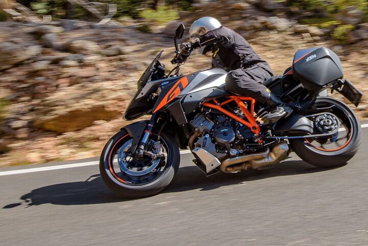 2017 ktm 1290 super duke gt first ride review, The GT s angular nose points its way through apexes Note the exhaust plumbing under the engine necessary to meet noise emissions requirements
