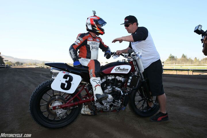 indian scout ftr750 ride review, Carr confers with an Indian team crewman With his vast experience Carr had the ears of the Indian team after each session Yeah we know We picked a pretty awesome test rider