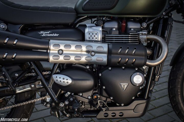 2017 triumph street scrambler first ride review, They stuck the catalytic converter between that front black cover and the cylinder head It was no problem on my chilly ride around Seville Engineer David Lopez says it s not one on hot days either but this is not the bike for shorts and flip flops