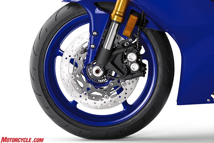 2017 yamaha yzf r6 review, Brake discs are bigger now and the wheel speed sensor in the center is used for both ABS and traction control functions Both Bridgestone and Dunlop are supplying tires for the R6