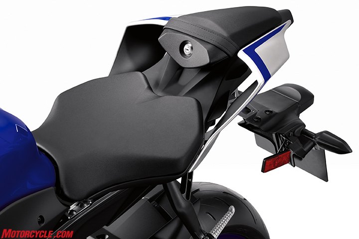 2017 yamaha yzf r6 review, The hollow sections of the tail is the result of heavy influence from the R1 A 5mm rise where the seat meets the tank is supposed to add a little comfort while the section just behind it is narrowed 8mm to help vertically challenged get a foot on the ground