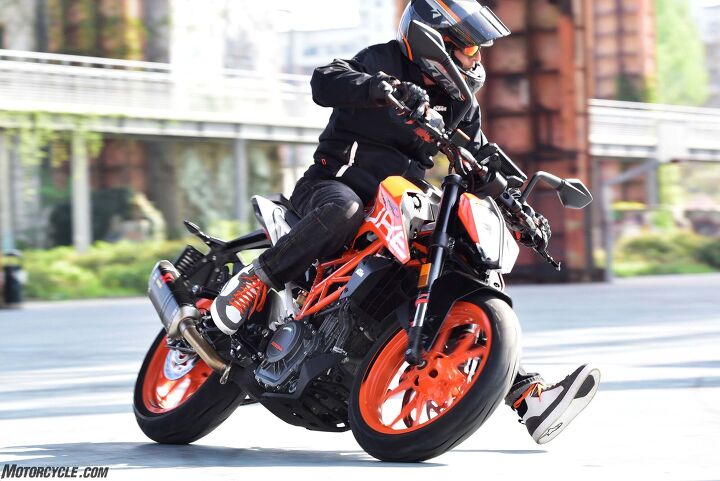 2017 ktm 390 duke review, Despite the weight gain the 390 Duke can still rip up a twisty road or scythe through traffic like nobody s business The Metzeler Sportec M5 tires on this bike gripped better on pavement than whatever it was I was riding on here alongside a Torino skate park The svelte and unobtrusive turnsignals above the headlight are doomed by DOT regulations for replacement with something uglier for the American market