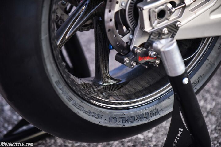bmw hp4 race first ride review, Here s the teeniest four piston caliper we ve ever seen along with a truly gorgeous carbon fiber wheel