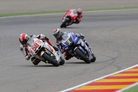 2011 motogp aragon results, While the Repsol Hondas were running up front Jorge Lorenzo found himself in a battle for third with Honda Gresini s Marco Simoncelli