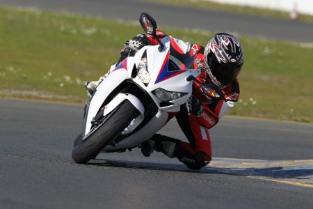 2012 honda cbr1000rr review video motorcycle com, Front end composure from the 43mm Big Piston Fork is noticeably greater compared to the traditional cartridge fork on the previous model