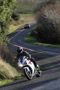 2012 honda cbr1000rr review video motorcycle com, Damp roads like this are easy to navigate thanks to the smooth power from the torque rich engine