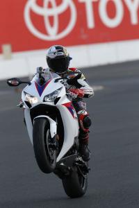 2012 honda cbr1000rr review video motorcycle com, Former Daytona 200 winner and longtime Honda rider Jake Zemke was on hand to ride with us journos And that s our GoPro video camera capturing Jake s wild lap