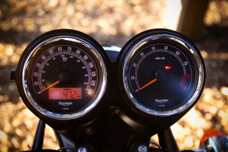 2012 triumph scrambler review motorcycle com, The Scrambler is fitted with dual gauges framed by chrome bezels The LCD odo clock is a giveaway they re not vintage Smiths