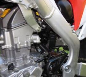2011 honda crf250r review motorcycle com, Fuel Injection calibration changes and lower overall gearing combine with the new exhaust to boost power for 2011
