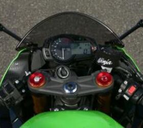 2013 kawasaki ninja zx 6r review motorcycle com, An analog tachometer dominates the gauge cluster while the digital LCD screen displays a variety of information Adjustments to Showa s SFF BP fork are easily made with all the clickers conveniently placed atop the fork caps Note also the power and KTRC toggle on the left switchgrip