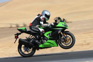 2013 kawasaki ninja zx 6r review motorcycle com, Power wheelies come often thanks to the extra power but they re easy to manage with your right hand Even if you re ham fisted the different TC settings will reign in wheelies before they go too far