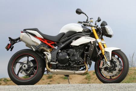 2012 triumph speed triple r review motorcycle com, At first glance you might think this is an average Triumph Speed Triple The gold fork and red highlights reveal that this is actually the Speed Triple R the more hard nosed and athletic version of the S3